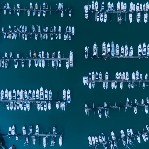 Image taken from above showing many boats in a harbour