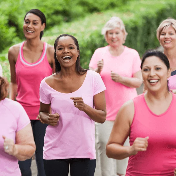 Client case - Trainimal - Women running and laughing dressed in pink